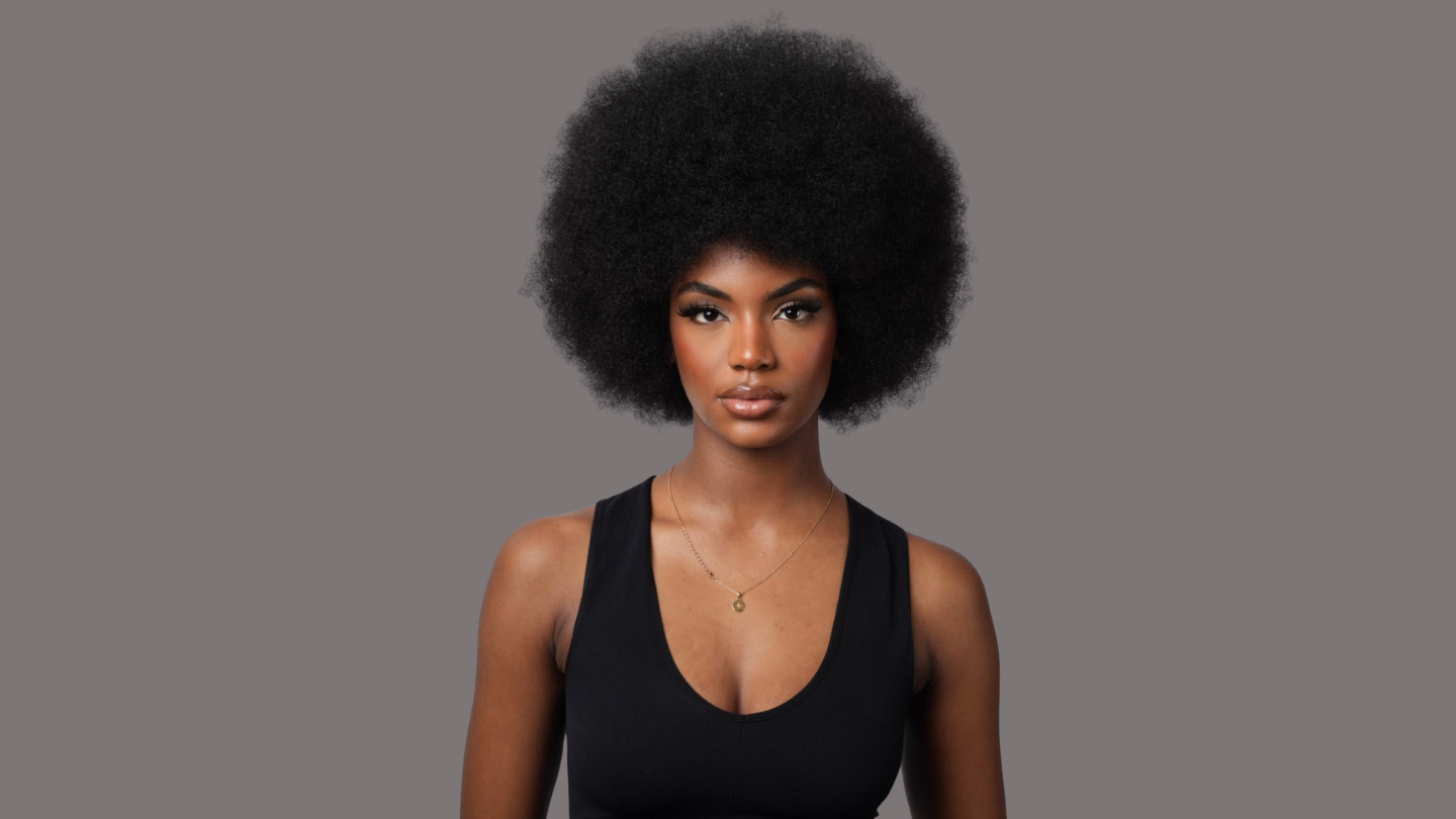 Model wearing her natural hair an afro before her shot
